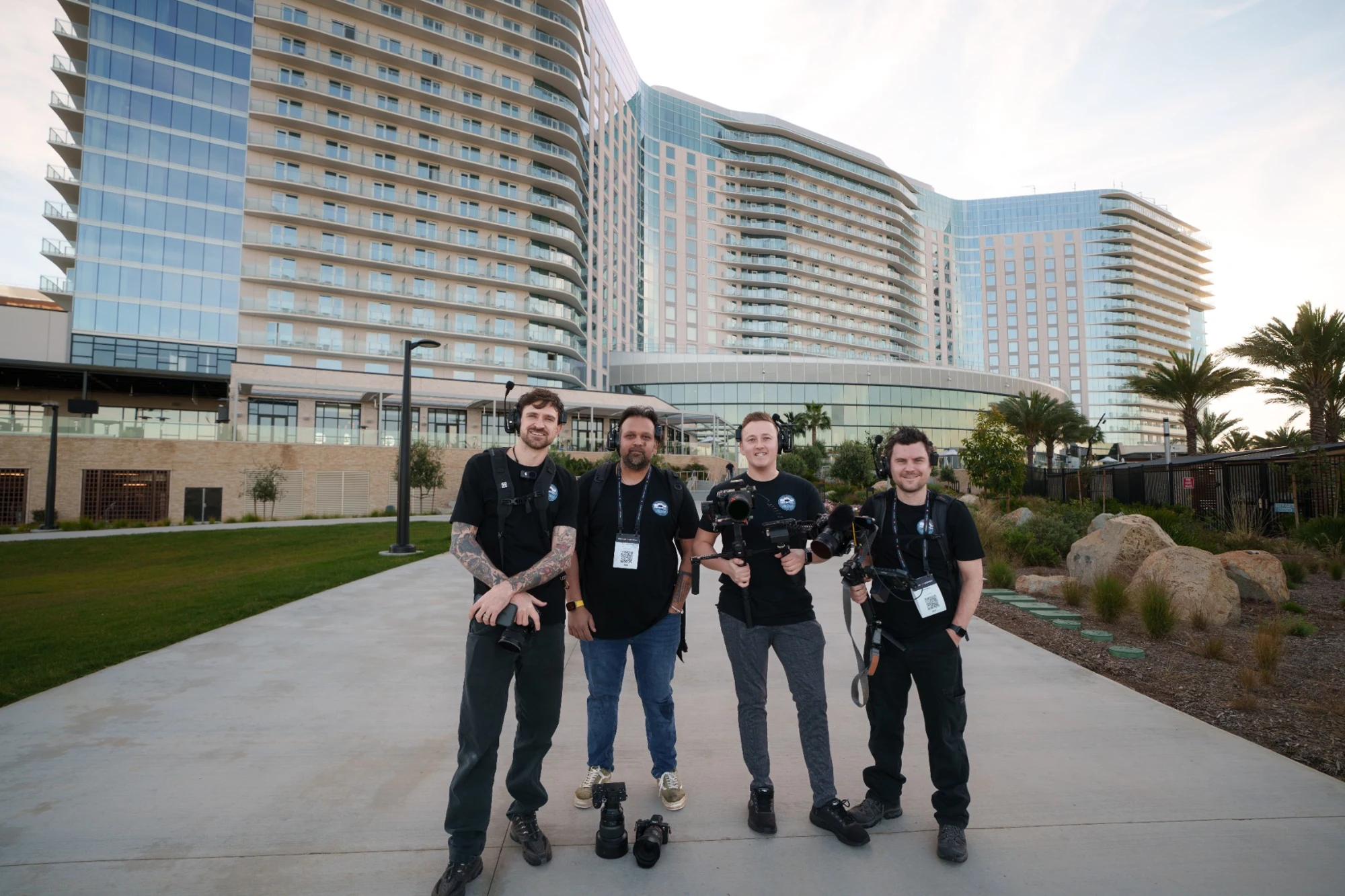 Four members of the Parnell Media production crew together on location with their cameras